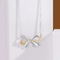 ネックレスのイヤリング925の純銀製の宝石類の真珠の蝶女性のS925の宝石類セット